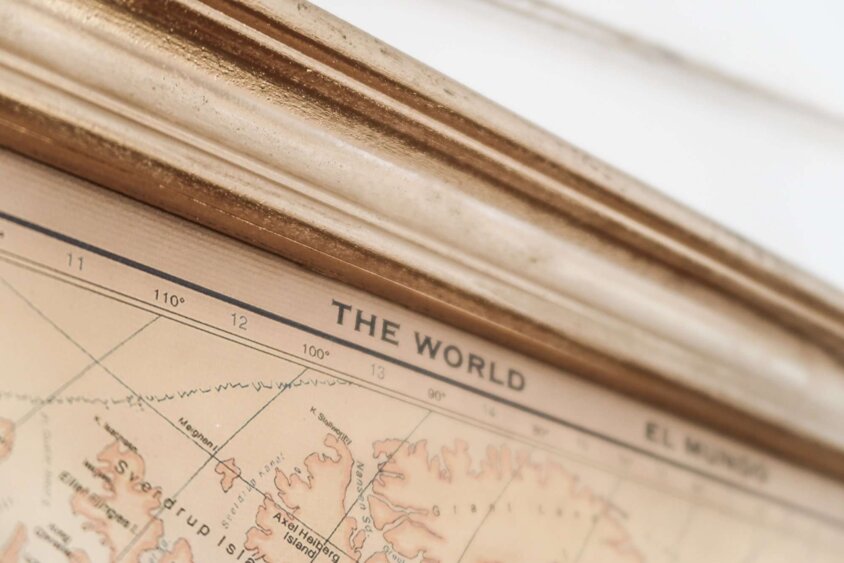 Chic map of the world with golden edges golden frame detail